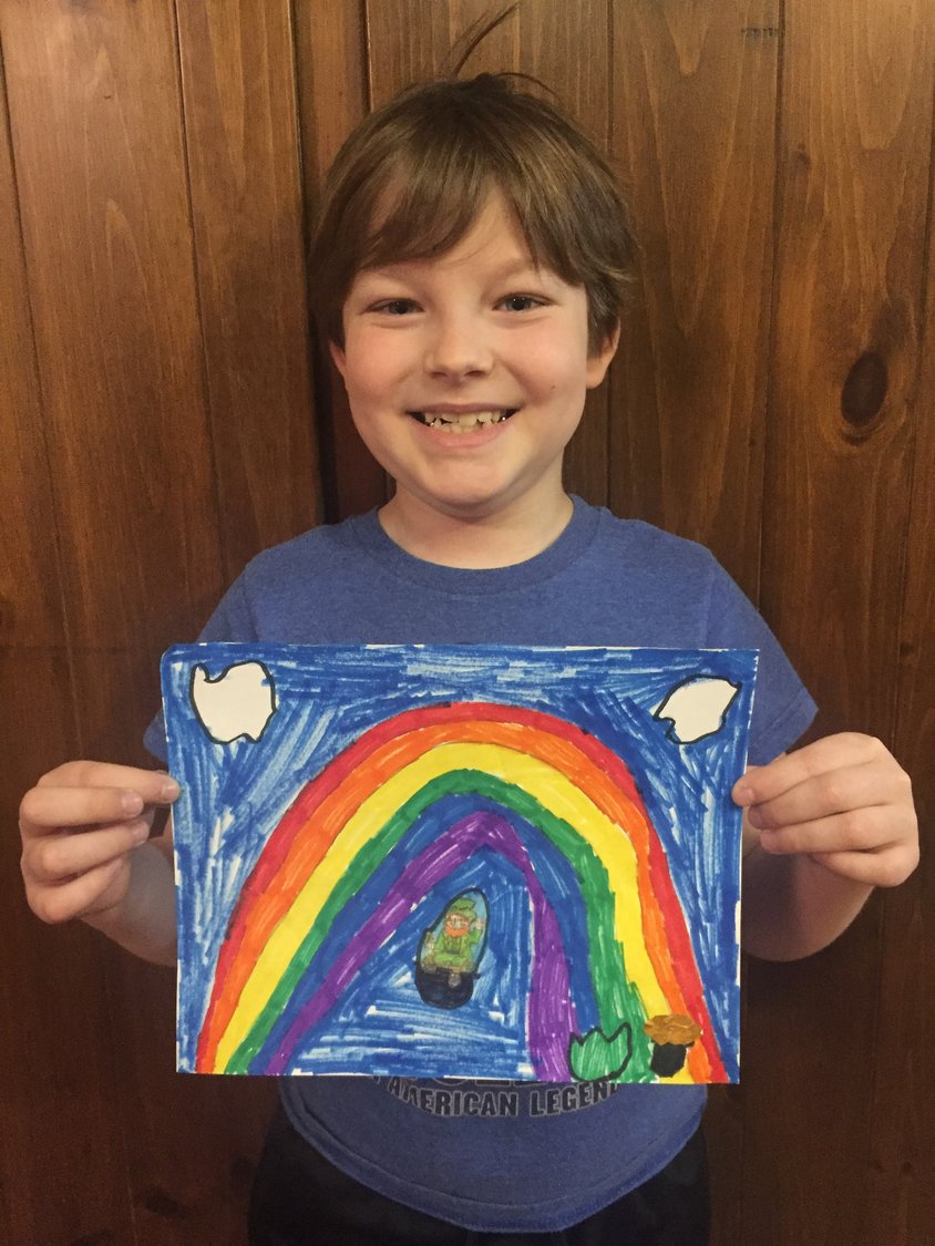 Second-grade Wayne Highlands student Luka Brdar with his rainbow artwork.